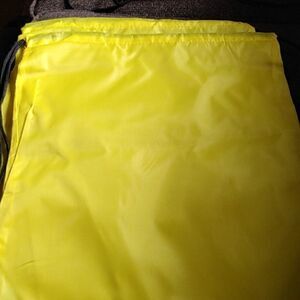 Two yellow drawstring bags  